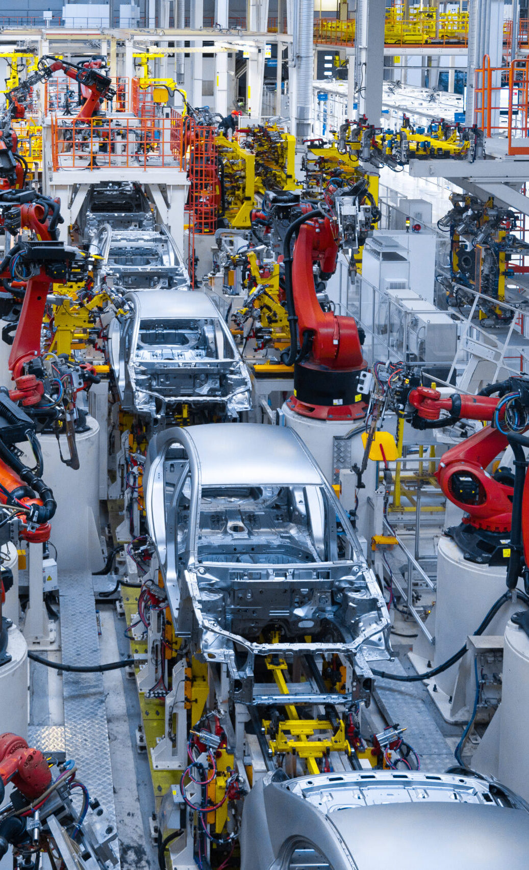 Assembly line production of new car. Automated welding of car body on production line. robotic arm on car production line is working