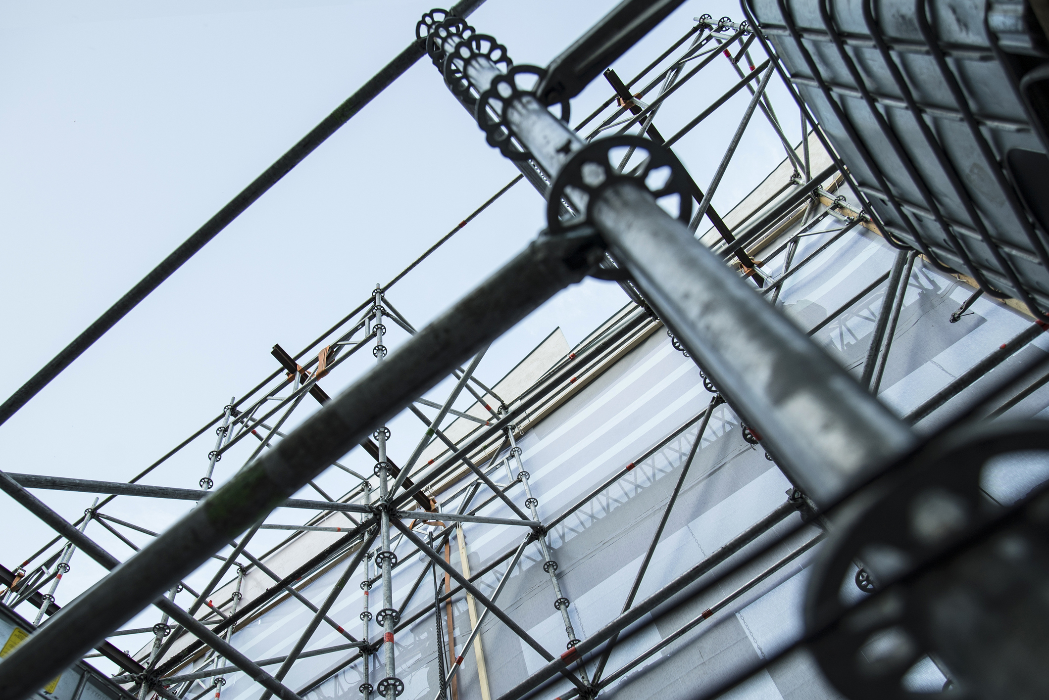 Extensive scaffolding providing platforms to support the structure.