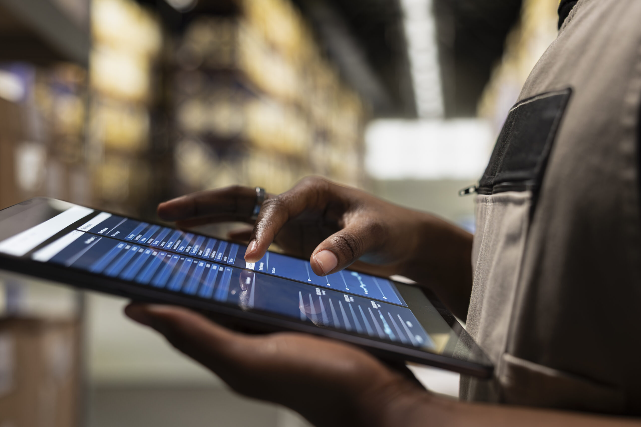 Close-up of an industrial worker verifying equipment and ensuring operational accuracy in a manufacturing environment.