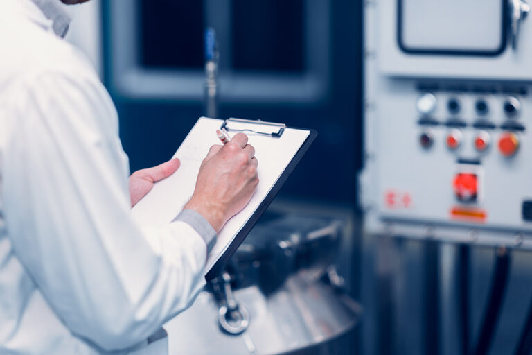 Manufacturing staff inspecting operations and ensuring everything is running smoothly in a modern factory.